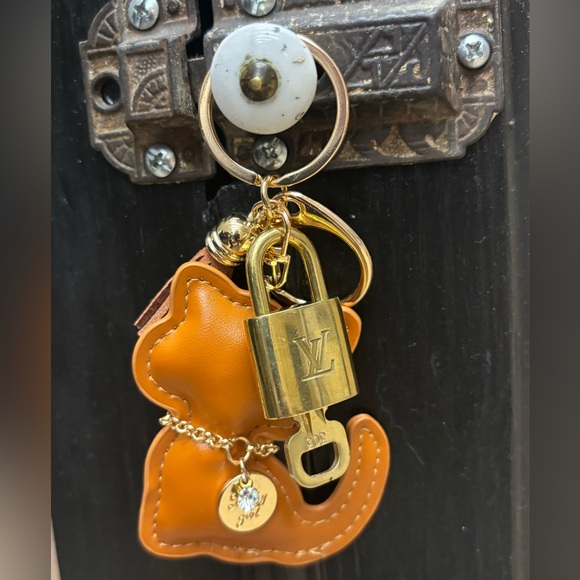 Louis Vuitton Accessories - Authentic Louis Vuitton Lock Key Burnt Orange Cat Tassel, Bag Charm,Key Chain